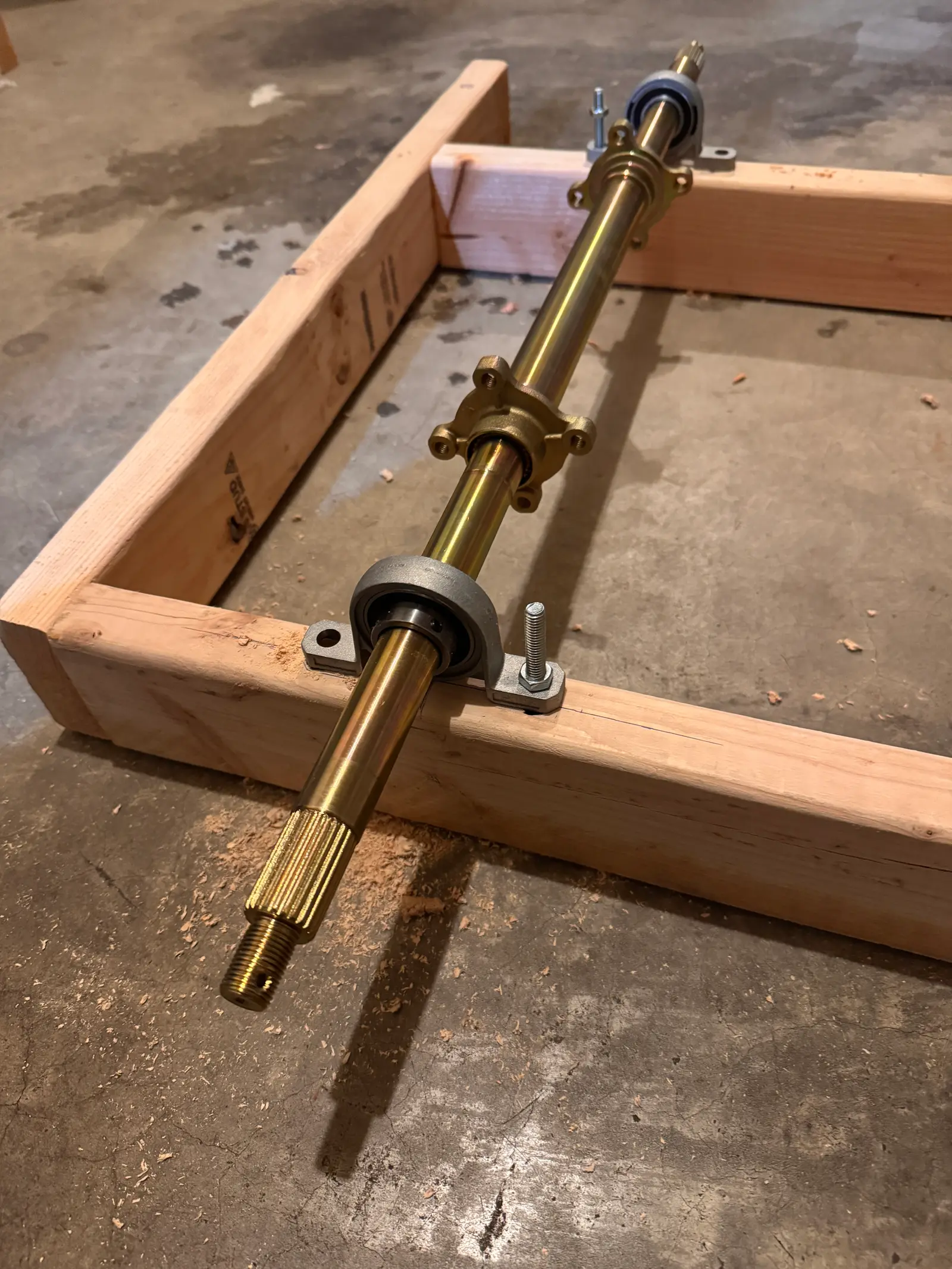 Timber frame with the rear axle and bearings mounted across it